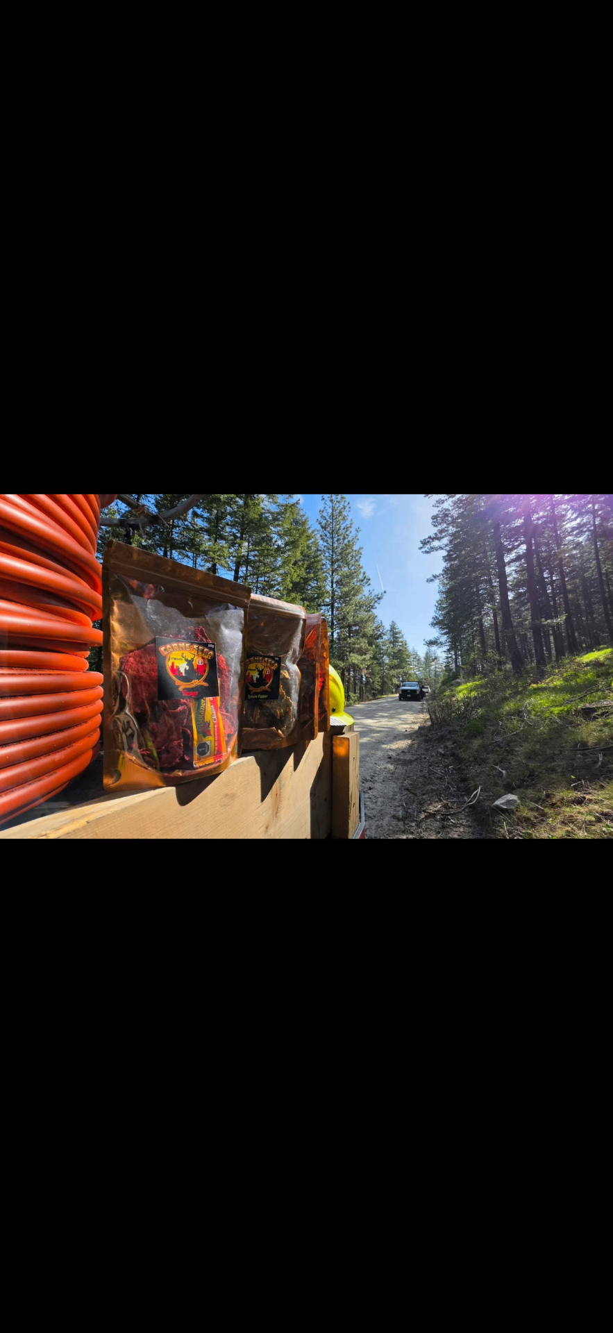 Carne Seca jerky bags on a worksite in the pines